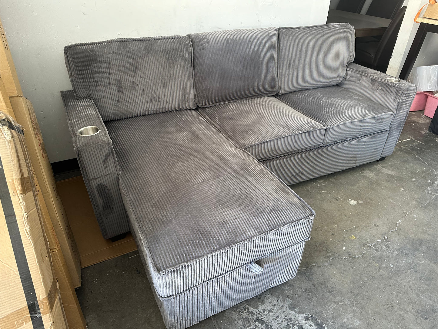 Sectional with pullout and reversible storage chaise