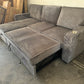 Sectional with pullout and reversible storage chaise