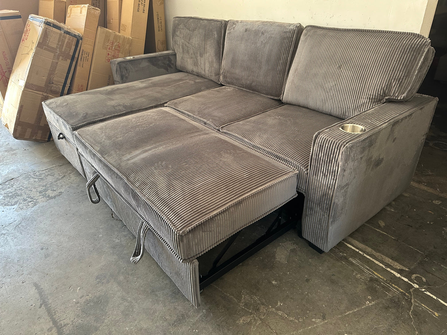 Sectional with pullout and reversible storage chaise