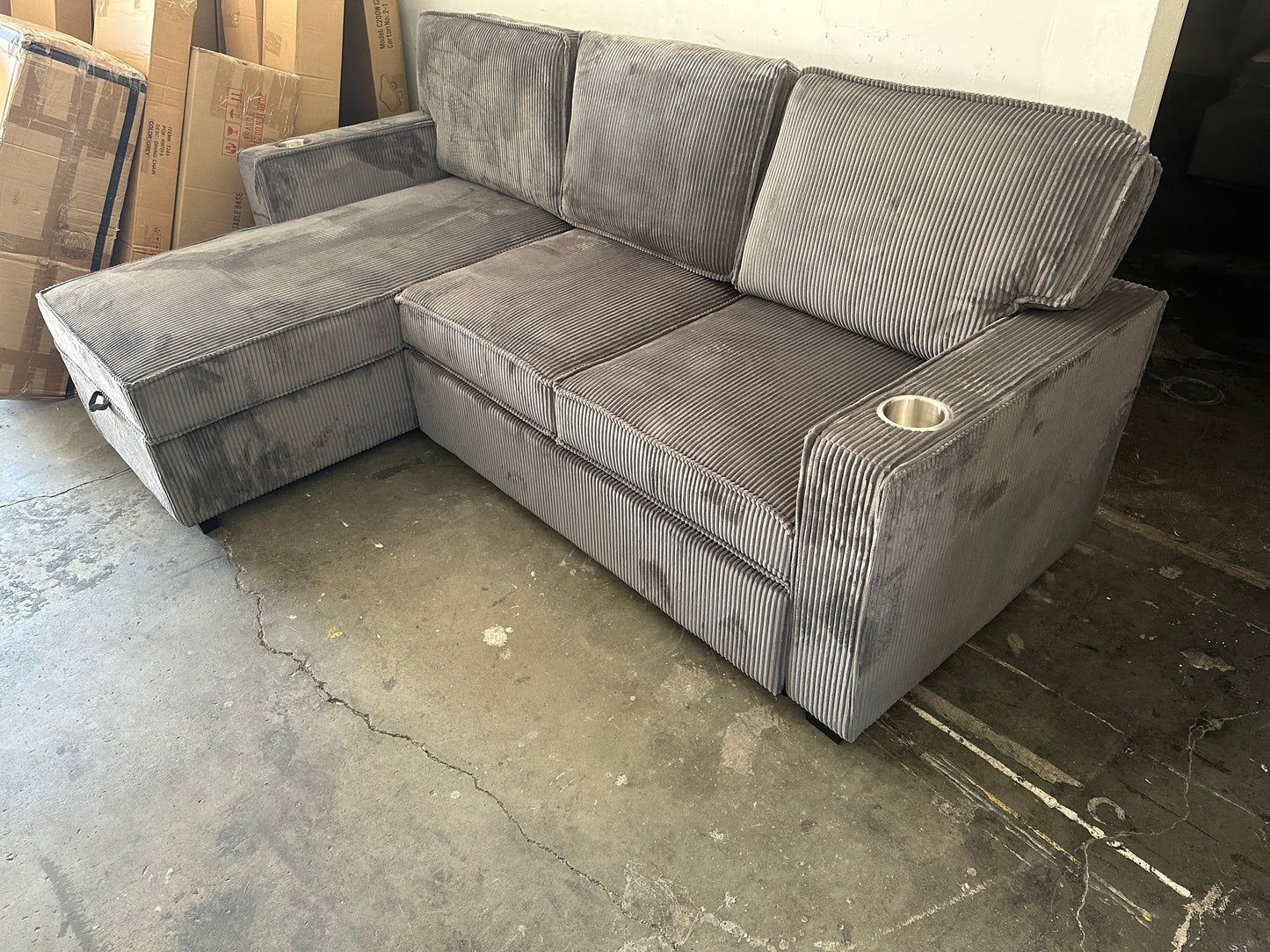 Sectional with pullout and reversible storage chaise