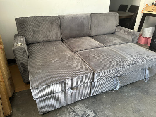 Sectional with pullout and reversible storage chaise